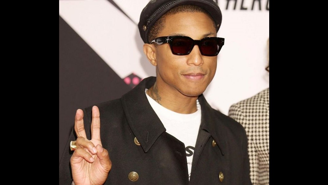 Pharrell Williams ed Emmy Rossum distribuiscono cibo ai meno abbienti