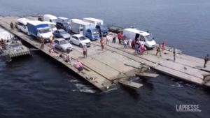 Ukraine: Images of a makeshift ferry to cross Dnepr river after a bridge was destroyed.