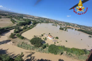 Floods in Italy kill 10; Survivors plucked from roofs, trees