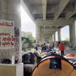 Migranti, la tendopoli di Ventimiglia vicino al fiume Roia