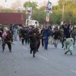 Pakistan’s ex-PM Khan leads rally, ignores arrest warrants