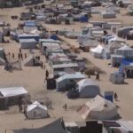 Gaza, cibo distribuito nel campo profughi di Muwasi