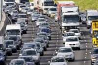 TRAFFIC CONGESTION CARS AND TRUCKS ON M25 MOTORWAY