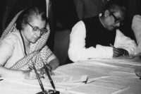 FILE- Indian Prime Minister Indira Gandhi, left, and Bangladesh Prime Minister Sheik Mujibur Rahman sign a 25-year treaty of \"Friendship, cooperation and peace\" in Dacca, Bangladesh on March 19, 1972. (AP Photo/File)