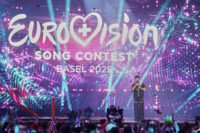 Winner of the Eurovision Song Contest JJ from Austria holds up the trophy onstage, he won with the song "Wasted Love" during the Grand Final of the 69th Eurovision Song Contest, in Basel, Switzerland, early Sunday, May 18, 2025. (AP Photo/Martin Meissner)