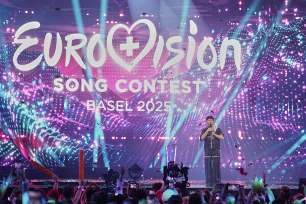 Winner of the Eurovision Song Contest JJ from Austria holds up the trophy onstage, he won with the song "Wasted Love" during the Grand Final of the 69th Eurovision Song Contest, in Basel, Switzerland, early Sunday, May 18, 2025. (AP Photo/Martin Meissner)
