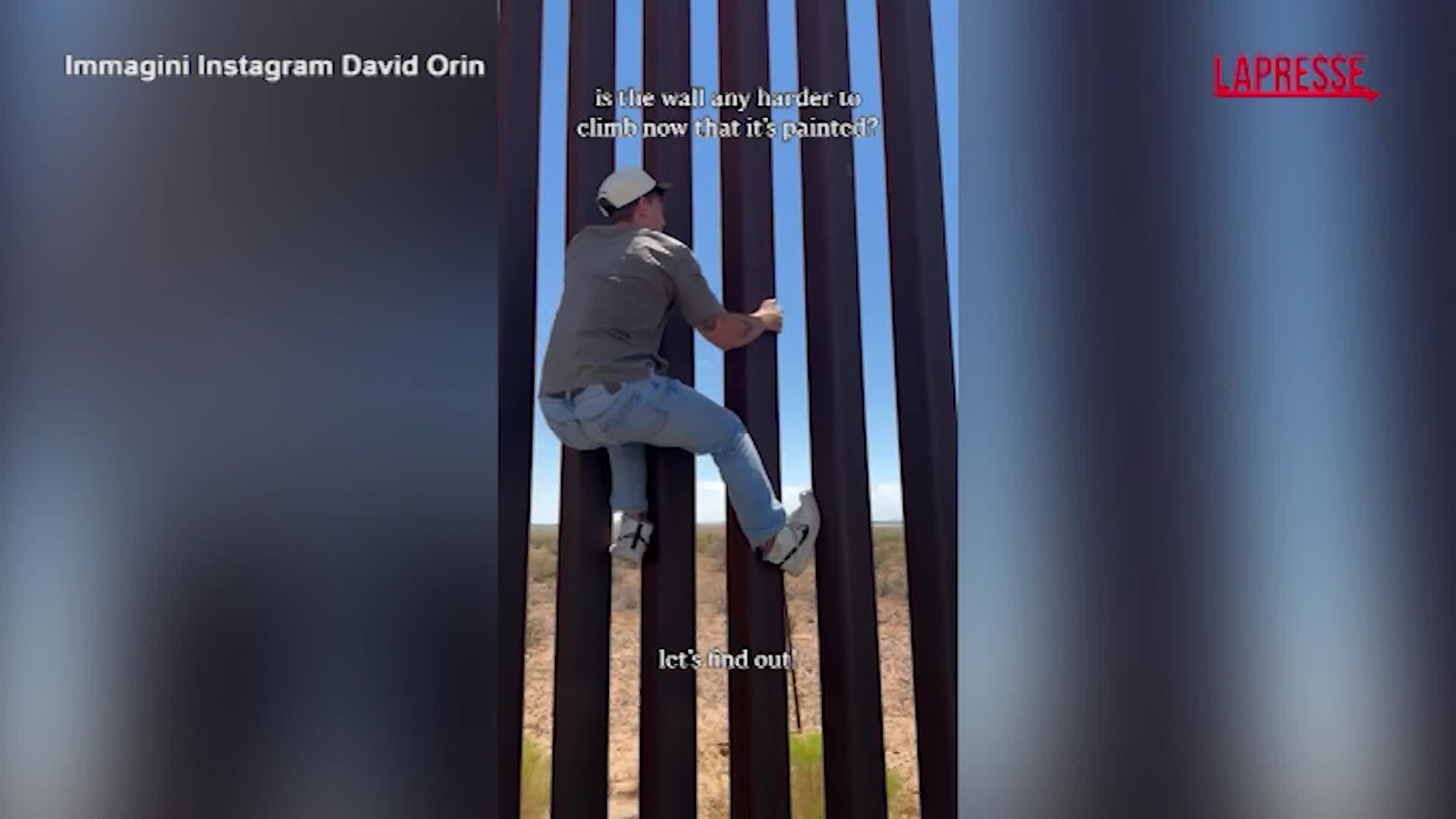 Influencer statunitense scala il muro anti migranti che divide Usa e Messico Influencer statunitense scala il muro anti migranti che divide Usa e Messico